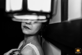 Black and white close-up at The Winslow Estate in Orleans, MA, capturing the bride’s preparation, highlighted by soft light and a sense of anticipation before the wedding ceremony.